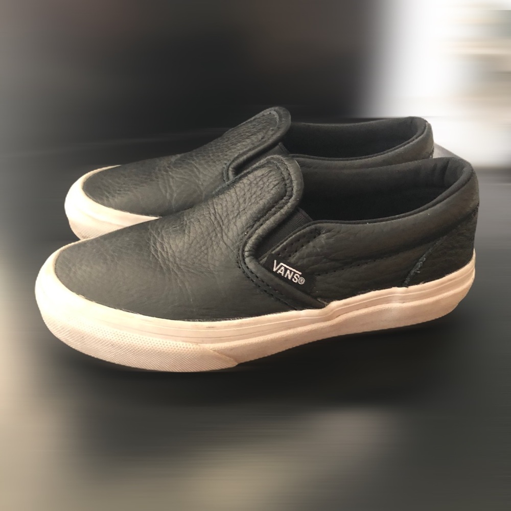 Boys black and white slip on Vans size 12.0